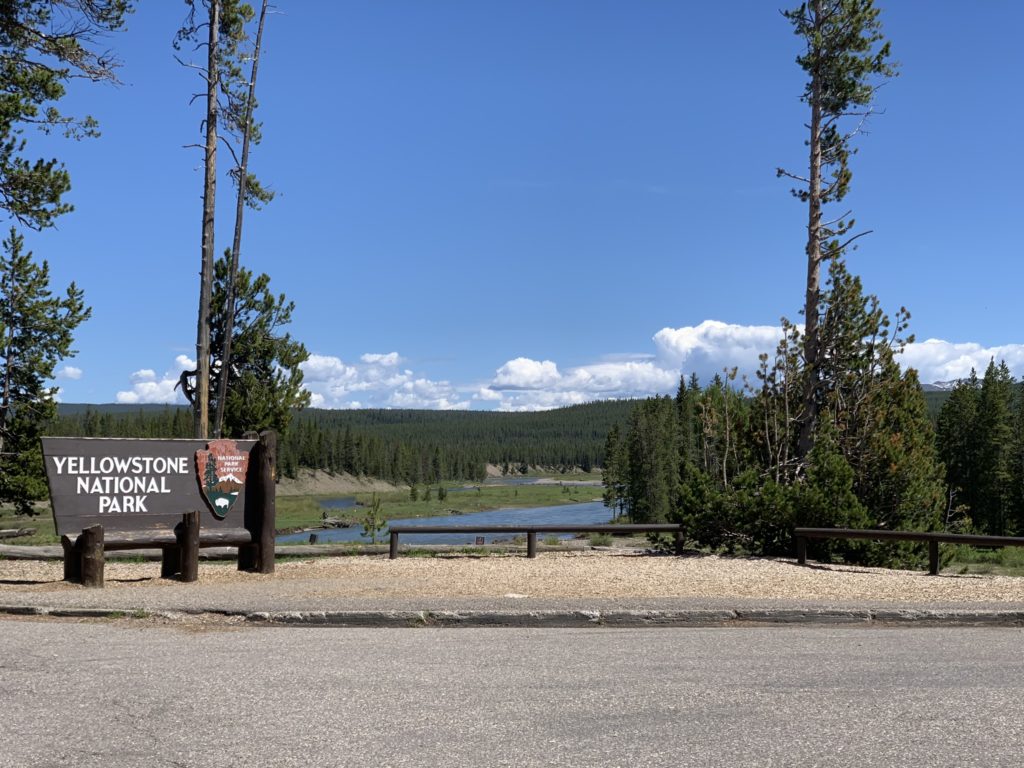 insider tips for visiting yellowstone, park sign