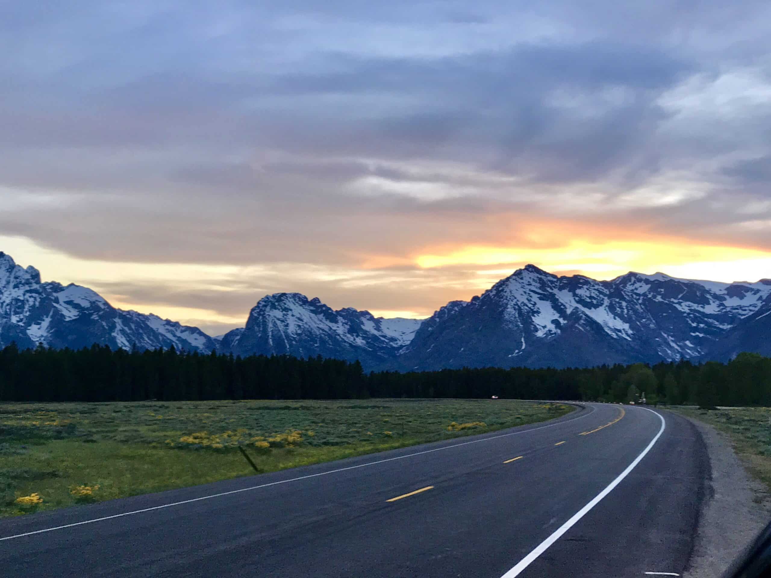 Road through Grand Teton National Park at sunset